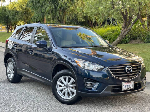 2016 Mazda CX-5 for sale at MILLENNIUM MOTORS in Van Nuys CA