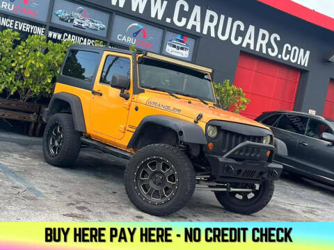 2012 Jeep Wrangler for sale at CARUCARS LLC in Miami FL