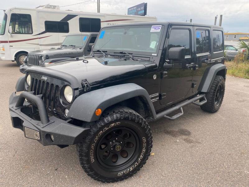 2014 Jeep Wrangler Unlimited for sale at Florida Coach Trader, Inc. in Tampa FL