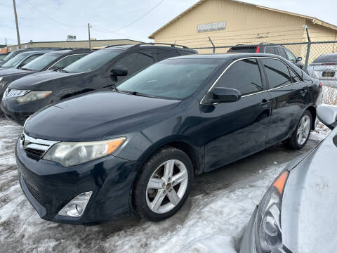 2014 Toyota Camry for sale at BELOW BOOK AUTO SALES in Idaho Falls ID