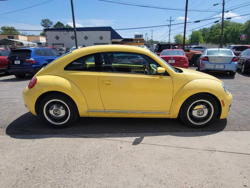 2012 Volkswagen Beetle for sale at DAGO'S AUTO SALES LLC in Dalton, GA