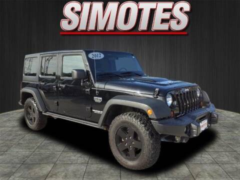 2012 Jeep Wrangler Unlimited for sale at SIMOTES MOTORS in Minooka IL