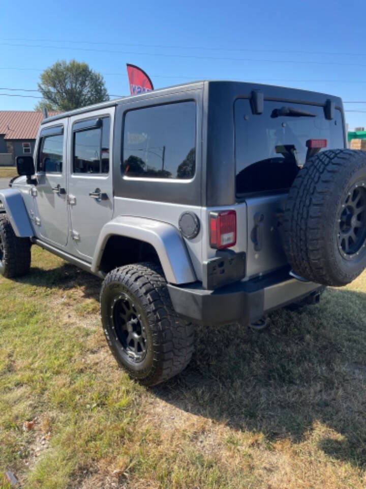 2014 Jeep Wrangler Unlimited for sale at Dixon Auto Sales in Pea Ridge, AR