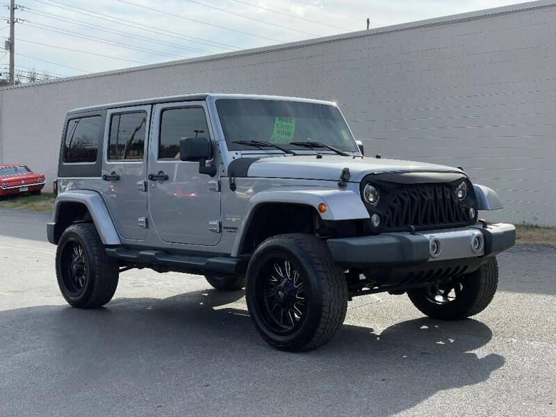 Used 2014 Jeep Wrangler Unlimited Sahara with VIN 1C4BJWEG4EL155977 for sale in Knoxville, TN