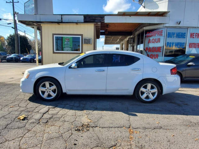 2013 Dodge Avenger for sale at DAGO'S AUTO SALES LLC in Dalton, GA