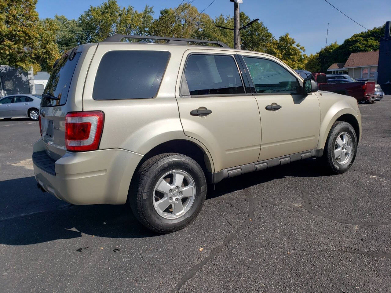 2011 Ford Escape for sale at Auto Shop in Wyoming, MI