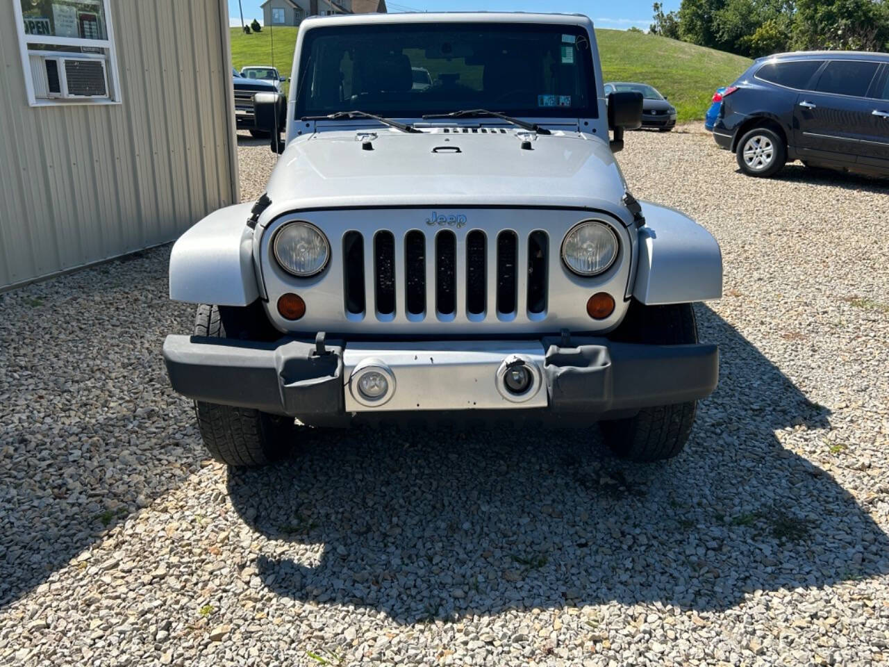 2012 Jeep Wrangler Unlimited for sale at STRODES AUTO GROUP LLP in Malta, OH