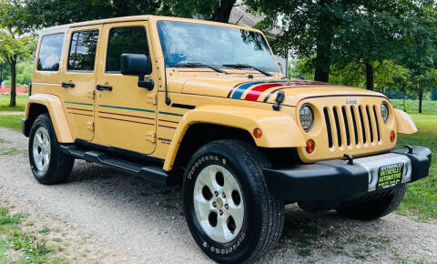 2013 Jeep Wrangler Unlimited for sale at Gutberlet Automotive in Lowell OH