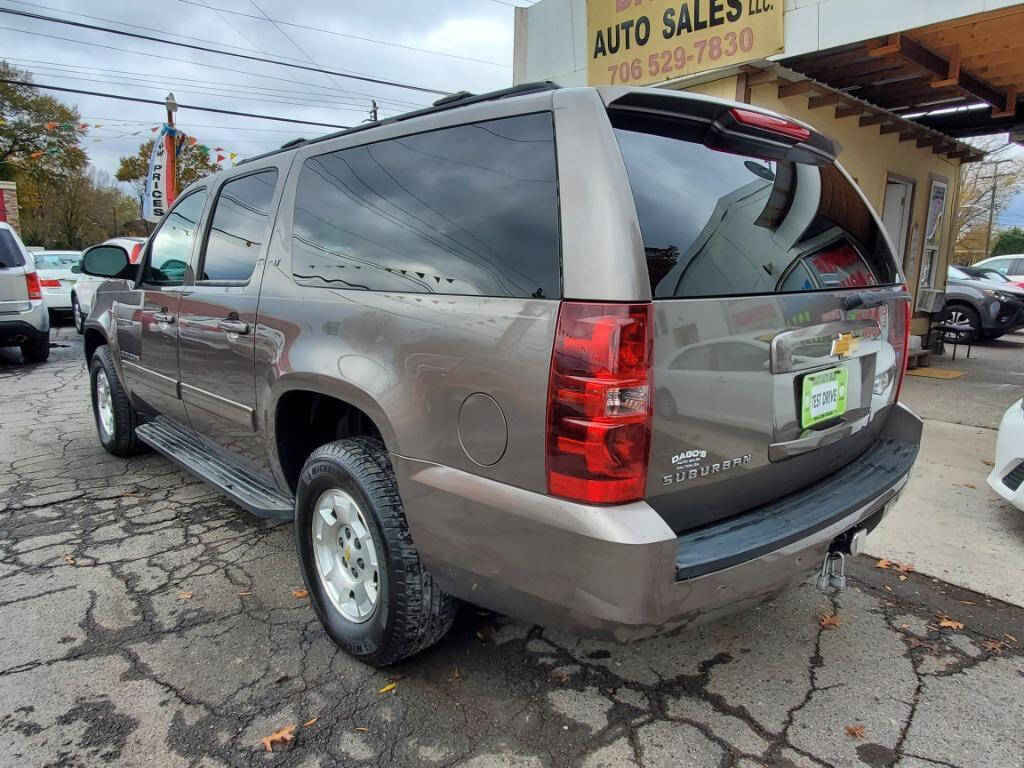 2013 Chevrolet Suburban for sale at DAGO'S AUTO SALES LLC in Dalton, GA