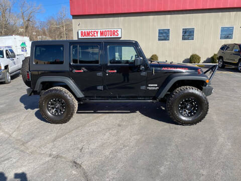 2014 Jeep Wrangler Unlimited for sale at Ramsey Motors in Riverside MO