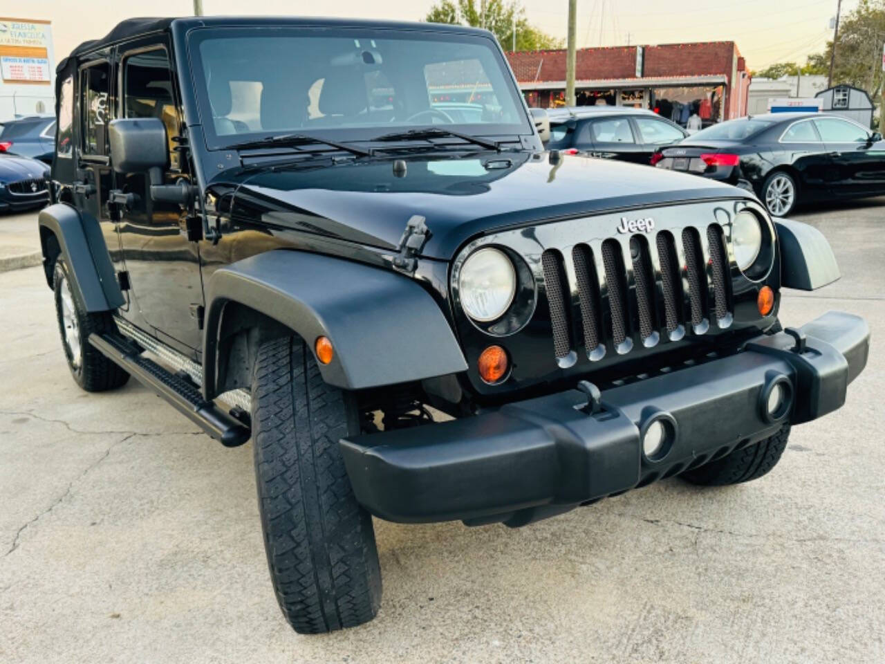 2012 Jeep Wrangler Unlimited for sale at AUTO LUX INC in Marietta, GA