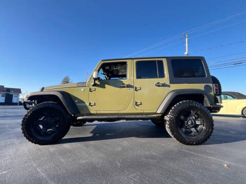 2013 Jeep Wrangler Unlimited for sale at Woolley Auto Group LLC in Poland OH