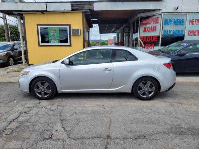 2010 Kia Forte Koup for sale at DAGO'S AUTO SALES LLC in Dalton, GA