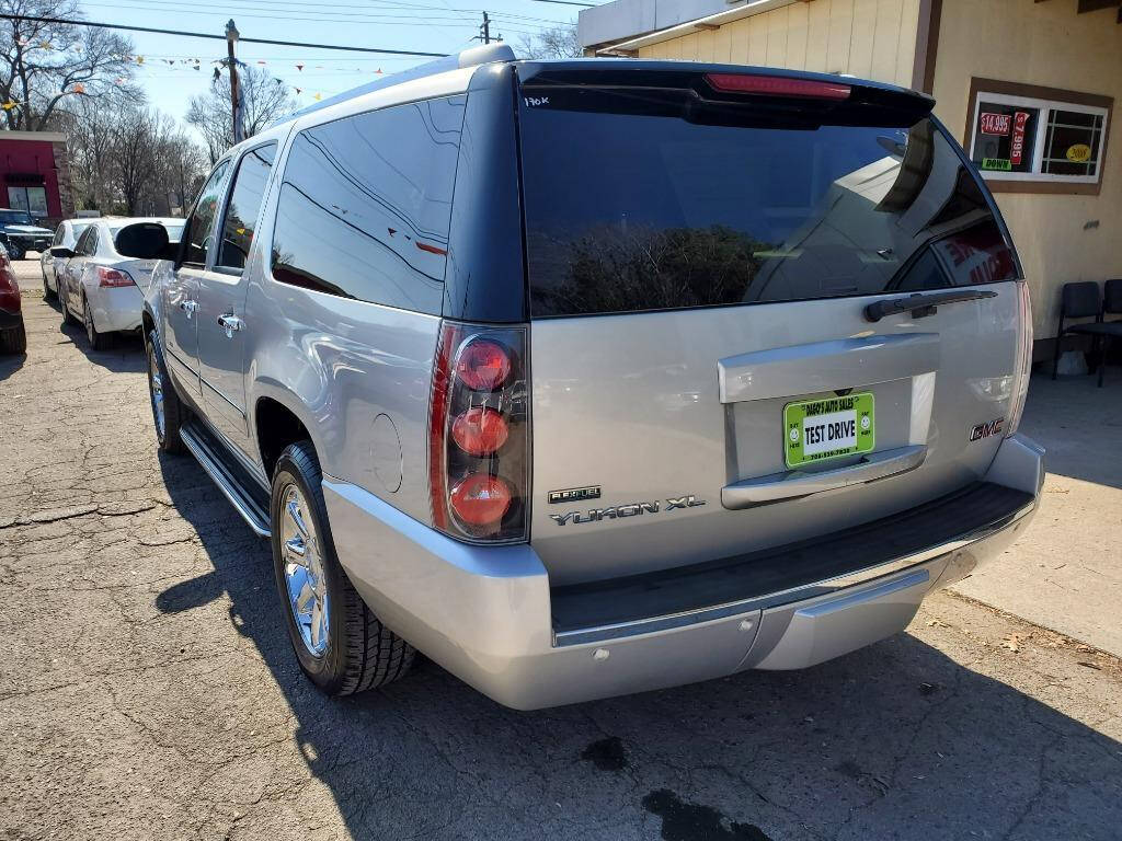 2011 GMC Yukon XL for sale at DAGO'S AUTO SALES LLC in Dalton, GA