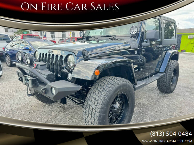 2014 Jeep Wrangler for sale at On Fire Car Sales in Tampa FL