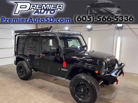 2012 Jeep Wrangler Unlimited for sale at Premier Auto in Sioux Falls SD