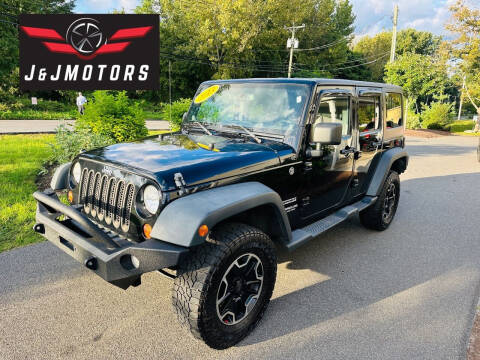2013 Jeep Wrangler Unlimited for sale at J & J MOTORS in New Milford CT