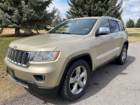 2011 Jeep Grand Cherokee for sale at BELOW BOOK AUTO SALES in Idaho Falls ID