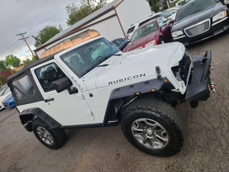 2014 Jeep Wrangler for sale at SANAA AUTO SALES LLC in Englewood CO