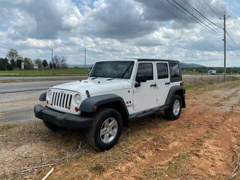 2009 Jeep Wrangler Unlimited for sale at Tennessee Valley Wholesale Autos LLC in Huntsville AL