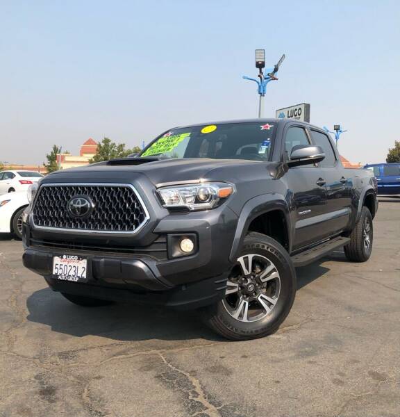 2018 Toyota Tacoma for sale at Lugo Auto Group in Sacramento CA