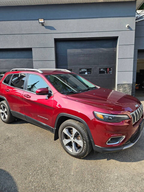 2019 Jeep Cherokee for sale at RENOS AUTO SALES LLC in Waterbury, CT