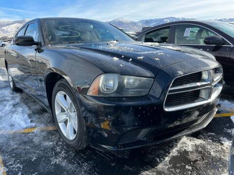 2012 Dodge Charger for sale at BELOW BOOK AUTO SALES in Idaho Falls ID