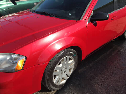 2013 Dodge Avenger for sale at Simmons Auto Sales in Denison TX