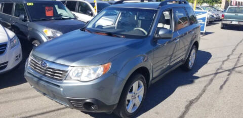 2009 Subaru Forester for sale at Howe's Auto Sales in Lowell MA