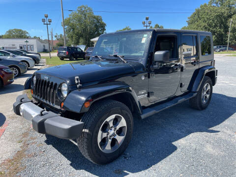 2010 Jeep Wrangler Unlimited for sale at LAURINBURG AUTO SALES in Laurinburg NC
