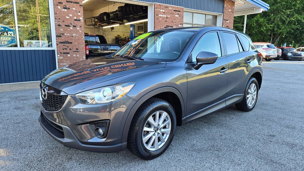 2015 Mazda CX-5 for sale at North Ridge Auto Center LLC in Madison, OH