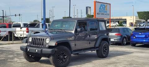 2014 Jeep Wrangler Unlimited for sale at Ark Motors in Orlando FL