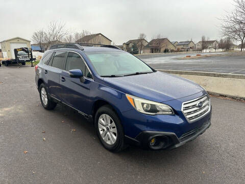 2015 Subaru Outback for sale at The Car-Mart in Bountiful UT