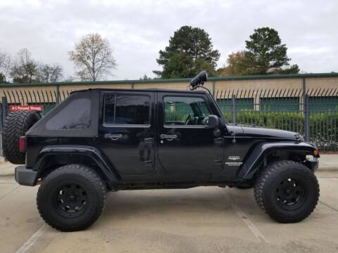 2011 Jeep Wrangler Unlimited for sale at Hollingsworth Auto Sales in Wake Forest NC