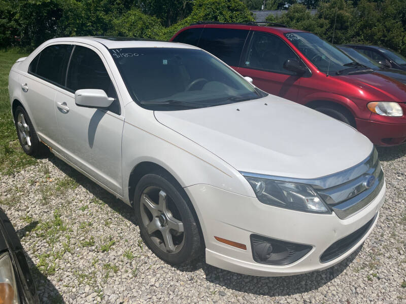 2011 Ford Fusion for sale at HEDGES USED CARS in Carleton MI