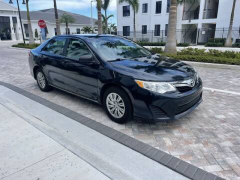 2014 Toyota Camry for sale at McIntosh AUTO GROUP in Fort Lauderdale FL