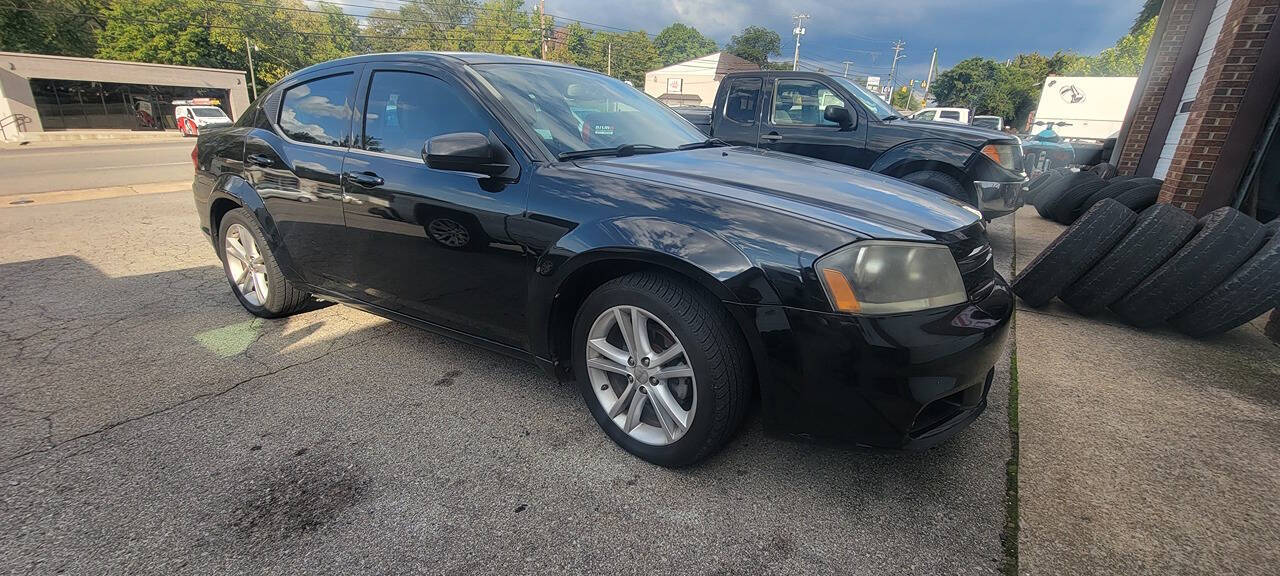 2013 Dodge Avenger for sale at Cars For Less in Clarksville, TN