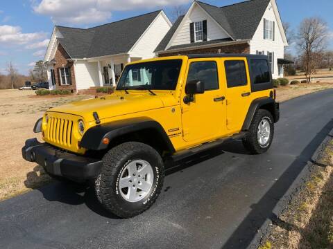 2011 Jeep Wrangler Unlimited for sale at Performance Auto Center Inc in Benson NC