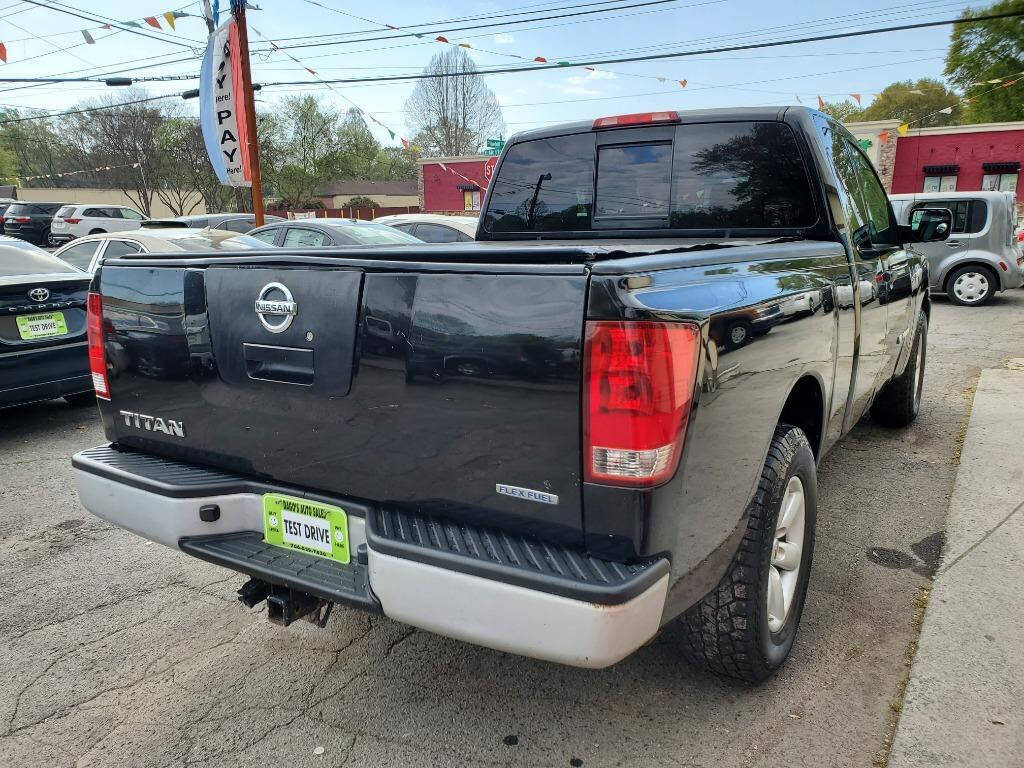 2011 Nissan Titan for sale at DAGO'S AUTO SALES LLC in Dalton, GA