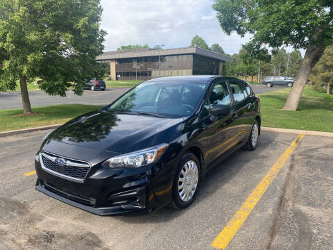 2018 Subaru Impreza for sale at QUEST MOTORS in Englewood CO