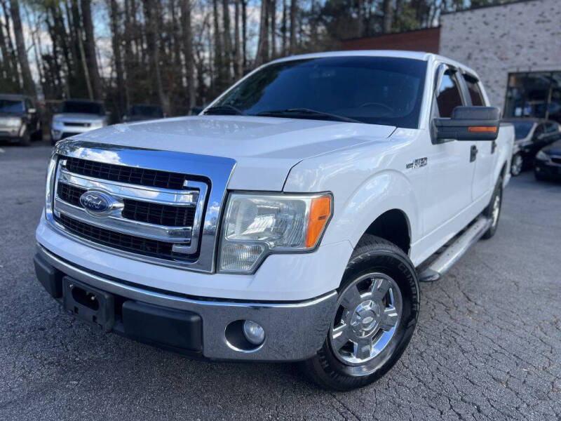 2013 Ford F-150 for sale at Atlanta Unique Auto Sales in Norcross GA