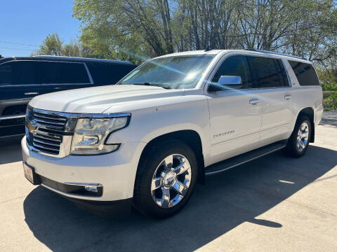 2015 Chevrolet Suburban for sale at Azteca Auto Sales LLC in Des Moines IA