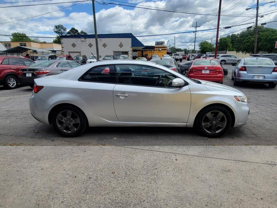 2010 Kia Forte Koup for sale at DAGO'S AUTO SALES LLC in Dalton, GA