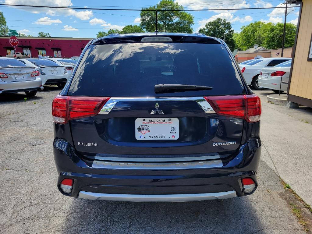 2016 Mitsubishi Outlander for sale at DAGO'S AUTO SALES LLC in Dalton, GA