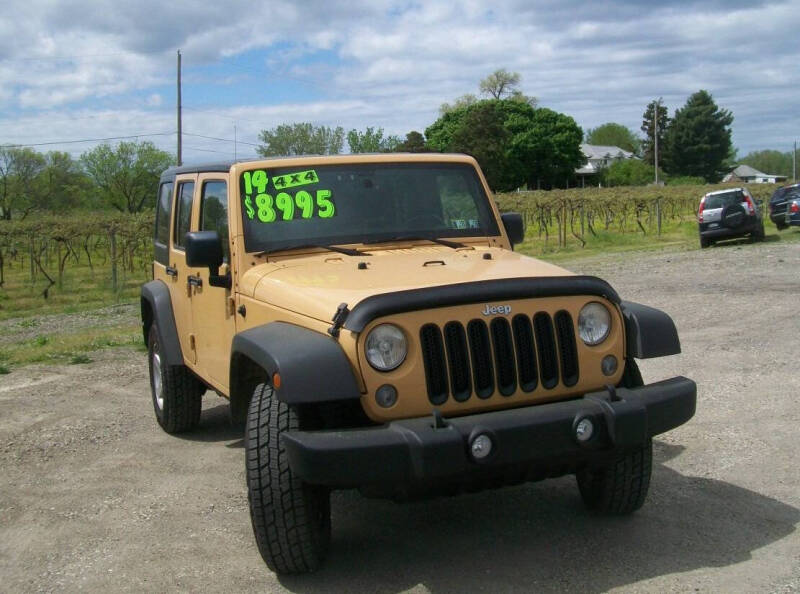 Used 2014 Jeep Wrangler Unlimited Sport with VIN 1C4BJWDGXEL149909 for sale in North East, PA