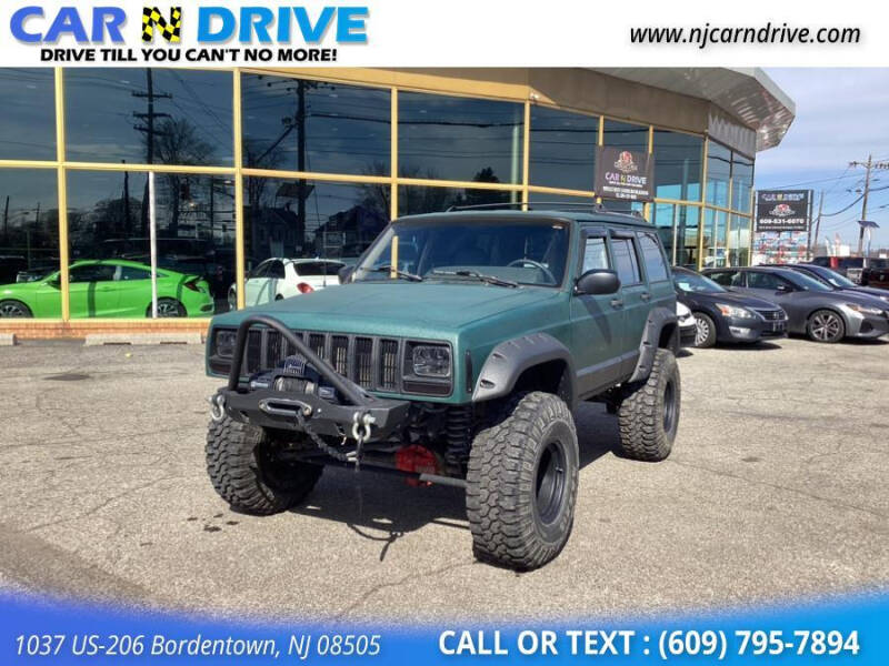 green lifted jeep cherokee