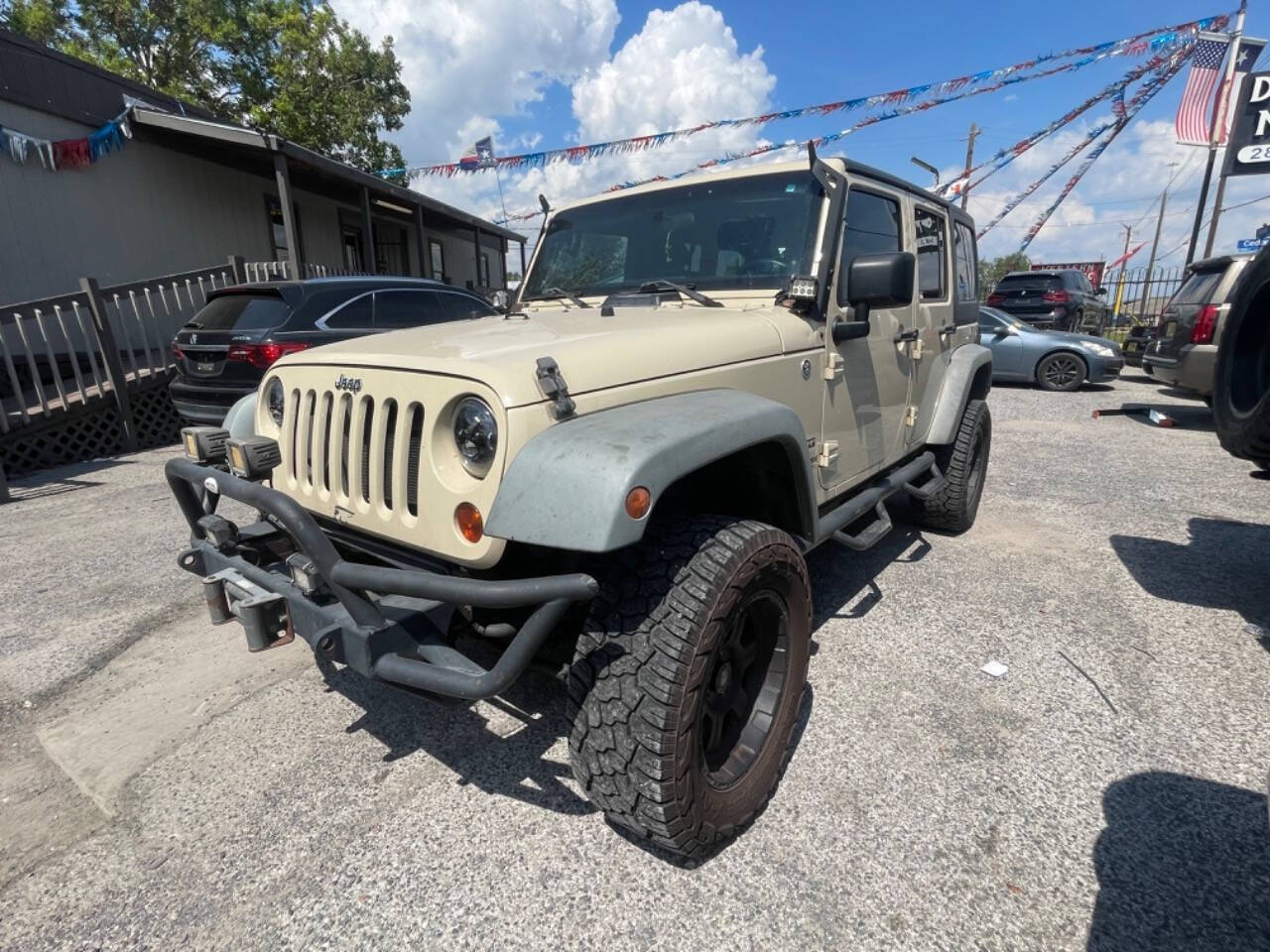 2011 Jeep Wrangler Unlimited for sale at DIAMOND MOTORS INC in Houston, TX