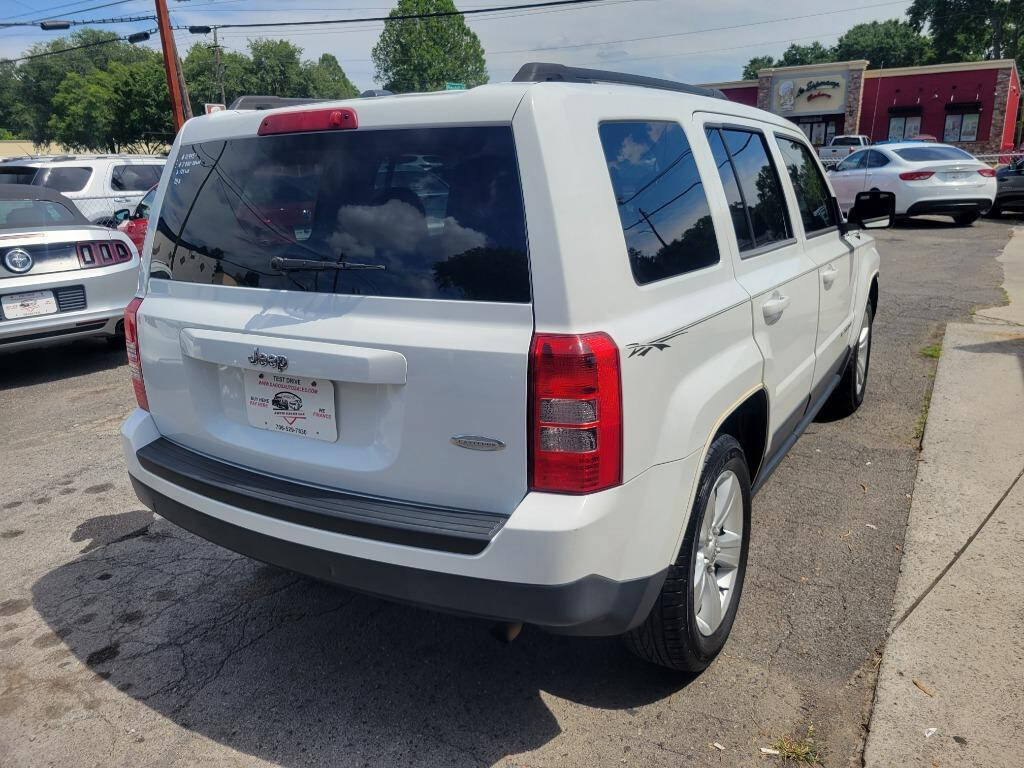 2014 Jeep Patriot for sale at DAGO'S AUTO SALES LLC in Dalton, GA