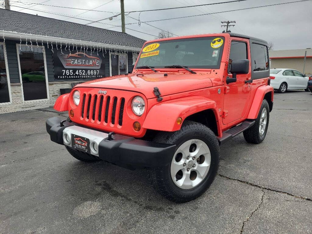 https://cdn05.carsforsale.com/1fadf2e7581c307d01366e863450714e/1280x960/2013-jeep-wrangler-sahara-4x4-2dr-suv.jpg