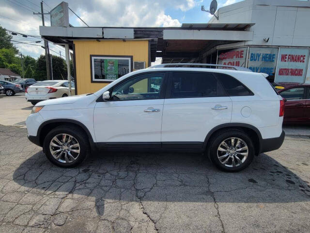 2011 Kia Sorento for sale at DAGO'S AUTO SALES LLC in Dalton, GA